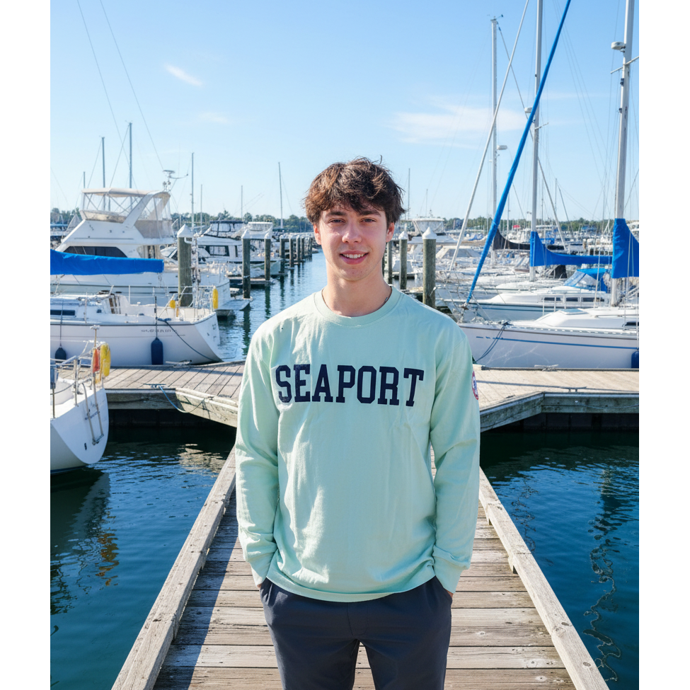 Man on harbor in green long sleeve t-shirt