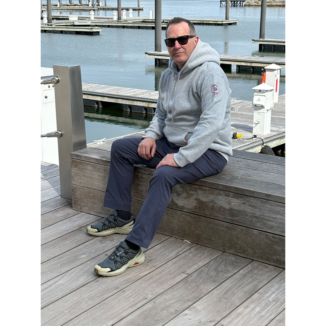 Man sitting on Boston Harborwalk