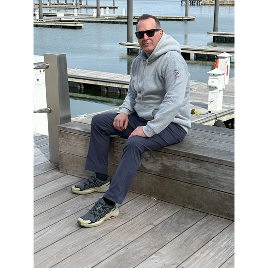 Man sitting on Boston Harborwalk