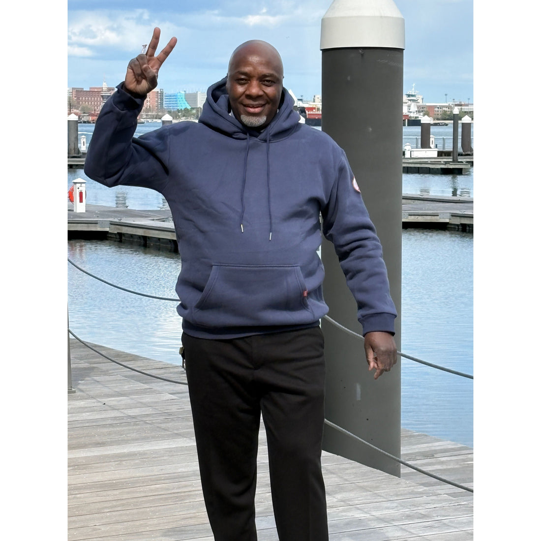 Man walking on harbor walk in Boston