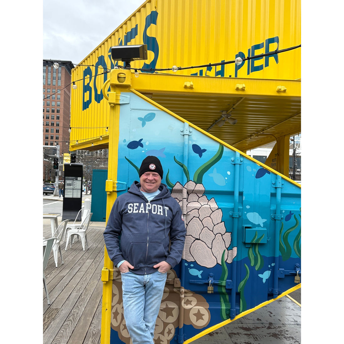 Man in Seaport zip hoodie and beanie