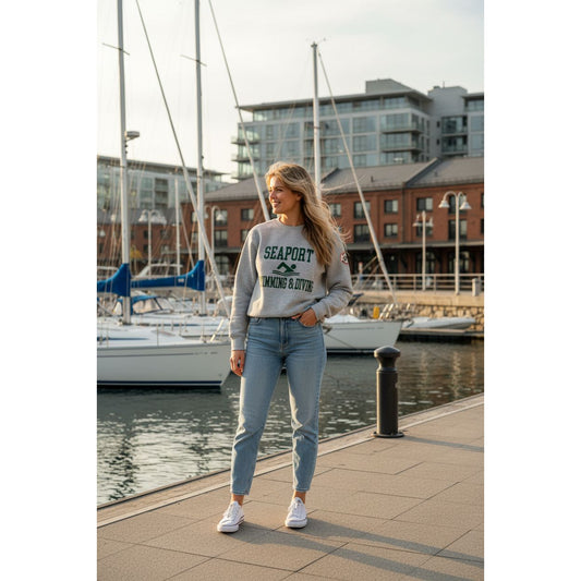 Woman on harbor in heavy sweatshirt