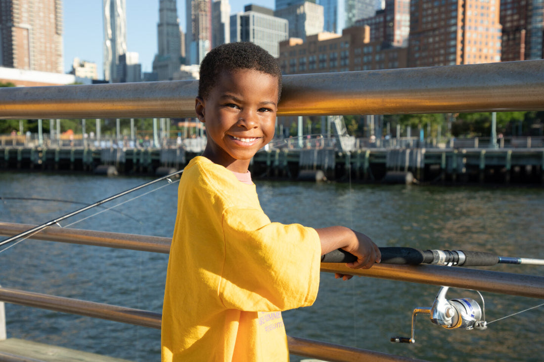Boy fishing from a pier