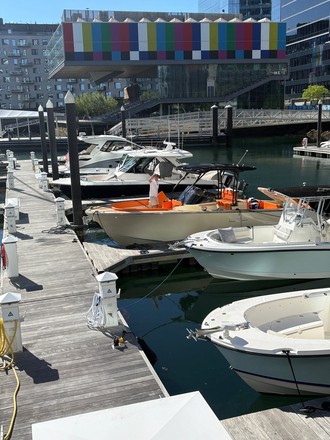 Man on boat in Boston harbor marina