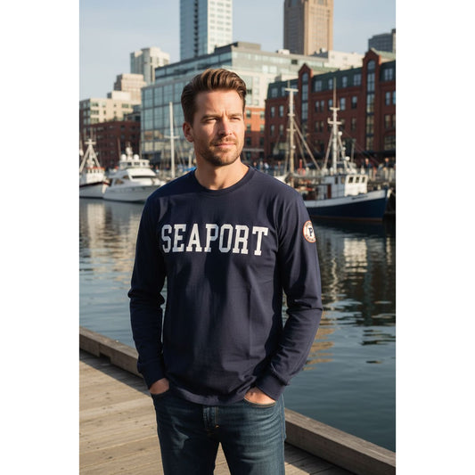 Man on marina in long sleeve tshirt with seaport text