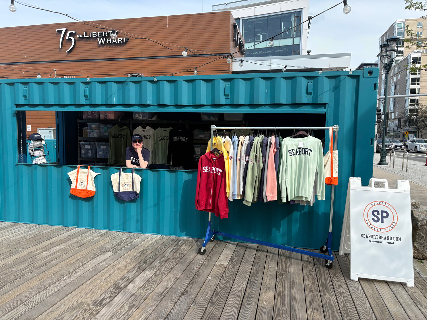 Seaport’s retail kiosk on Boston Fan Pier - an old marine shipping container with a roll up retail window.